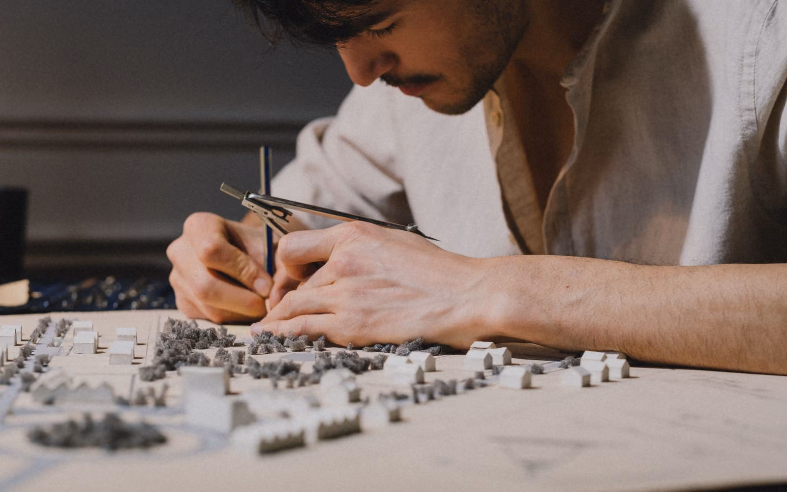 Architect working on a physical architectural model