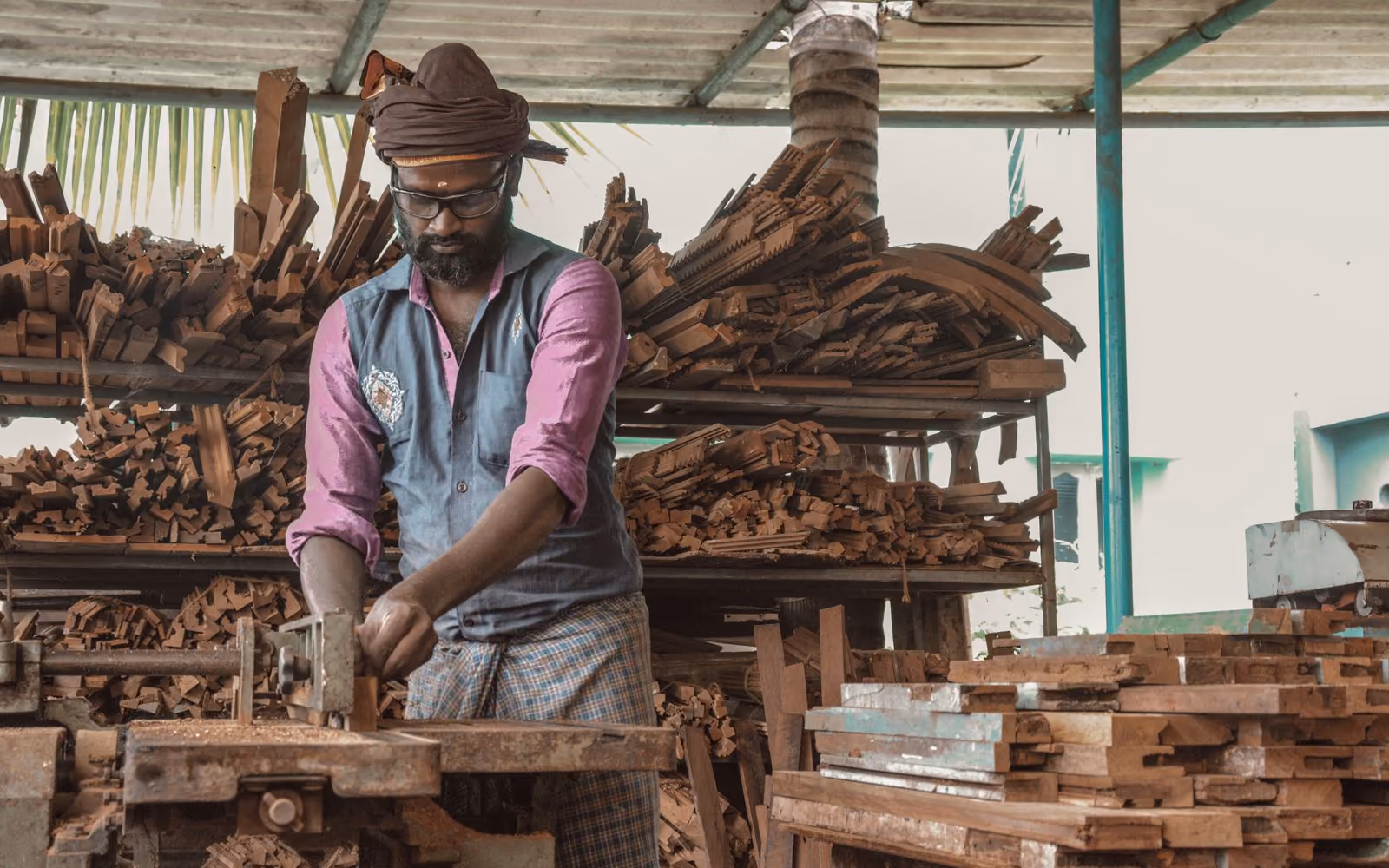 Carpenter working with wood in a workshop