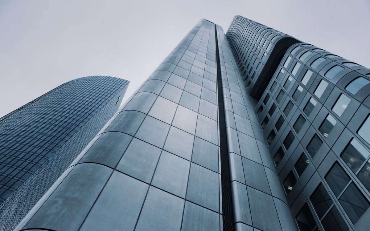 The Monolith Office - glass towers from street level (placeholder photo)