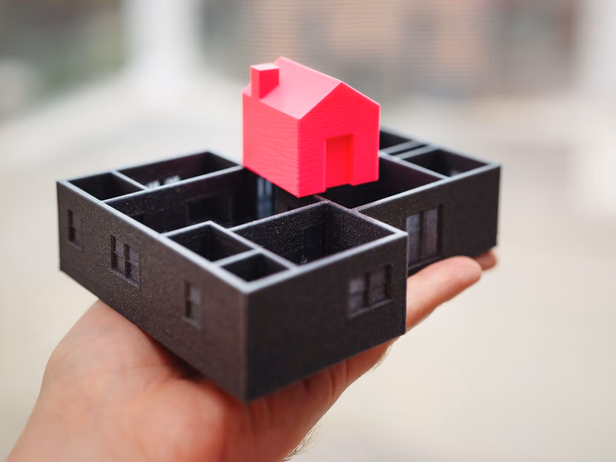 3D-printed architectural model held in hand