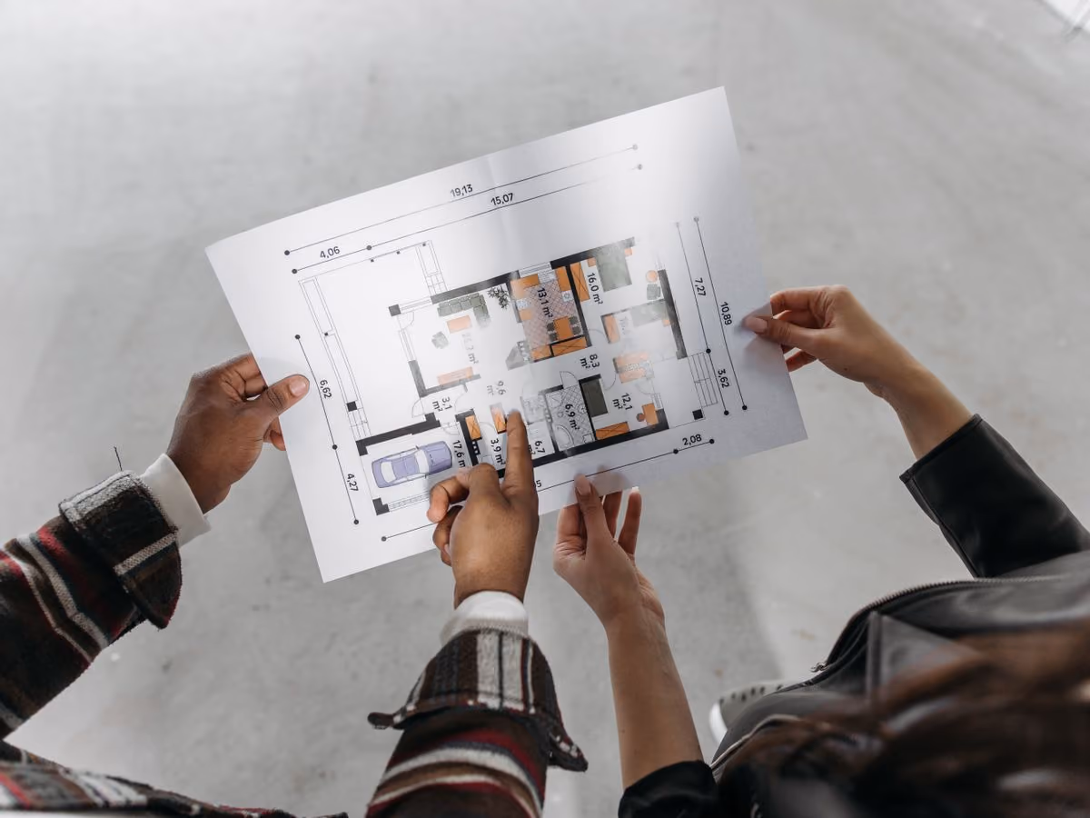 Couple reviewing a house blueprint together