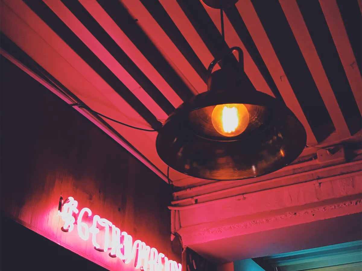 Pendant lamp against a warm-toned ceiling