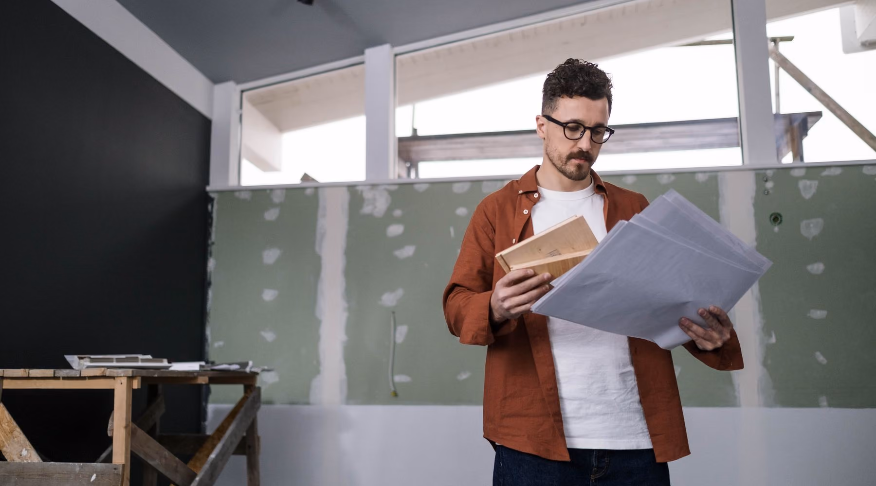 Consultant reviewing building plans (placeholder photo)